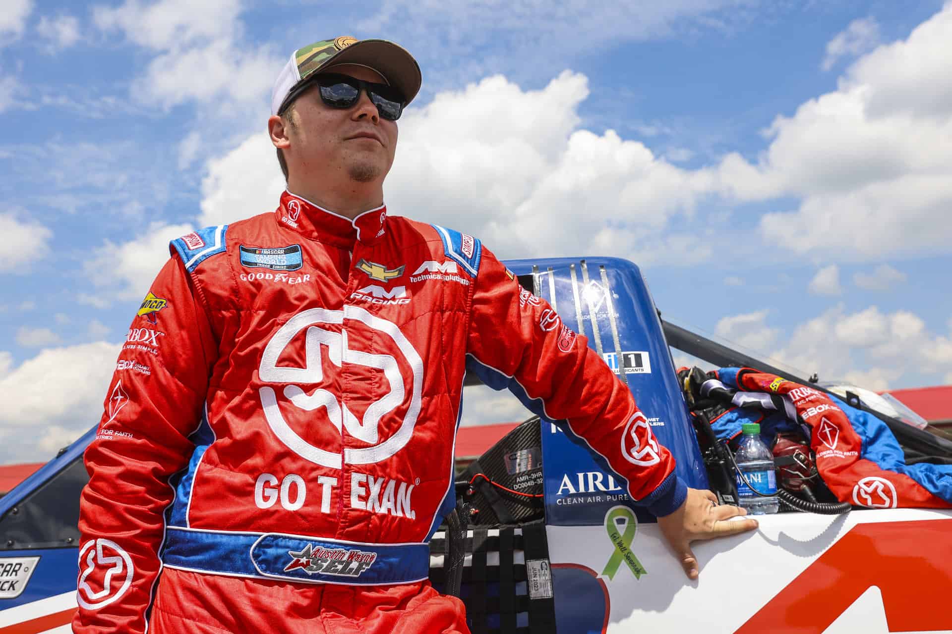 Austin Wayne Self races at Mid-Ohio Sports Car Course in the 2022 O'Reilly Auto Parts 150 for AM Racing in the NASCAR Camping World Truck Series.